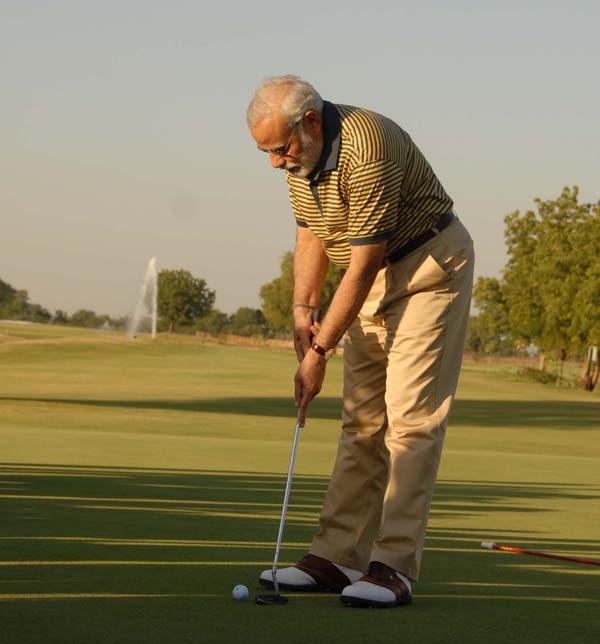 Modi in striped t-shirt and trousers