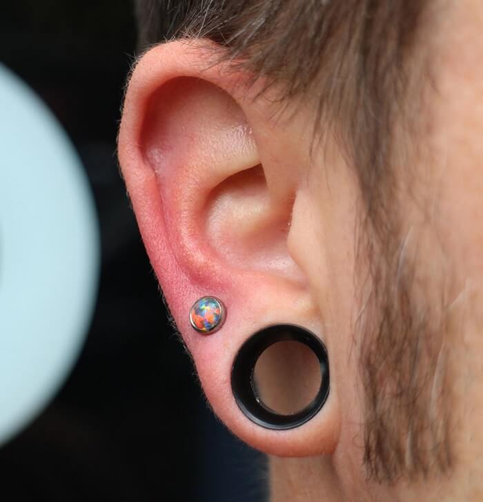 earlobe piercing with needle