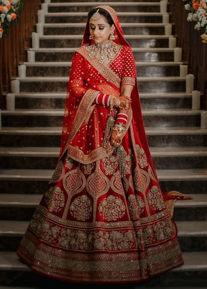 We're in absolute awe of this gorgeous Sabyasachi bride who shone brightly  on her big day in this stunning Sabyasachi Red lehenga. ❤ HMUA… | Instagram