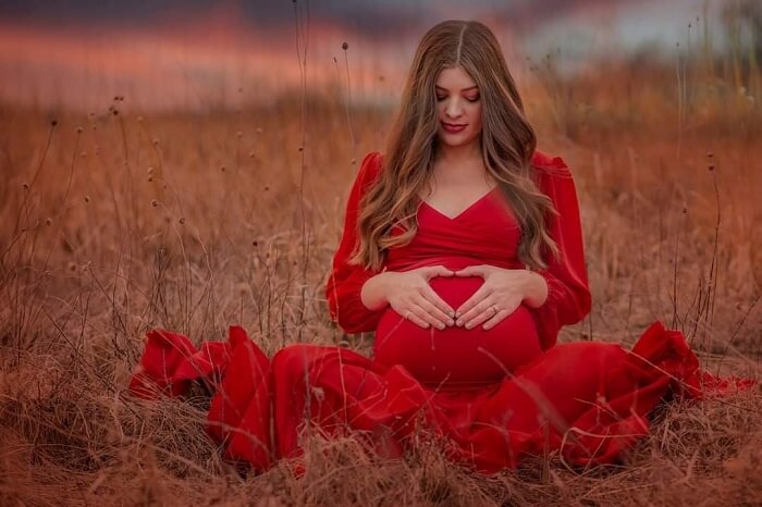 scarlet gown for maternity photoshoot